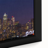 Black wall art featuring a textured, colorful depiction of the Seattle skyline on a large framed canvas.