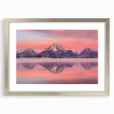 Textured abstract art print of the Grand Tetons in muted earth tones on a framed silver mat, suitable for bedroom decor.