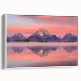 Vintage poster art of Wyoming's Grand Tetons in vibrant colors, framed in white, ideal for living room decor.