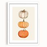 Abstract art print depicting fall foliage in warm orange and red tones on a white framed canvas, ideal for dining room decor.