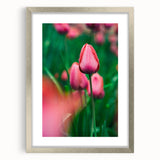 Textured art print depicting abstract spring-themed imagery in vibrant green and yellow hues, framed in silver.