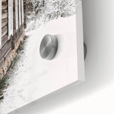 Large abstract wall art featuring a winter scene in muted gray and blue tones on acrylic glass.