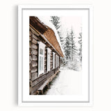 Abstract art print depicting a winter scene in muted blue and white tones, framed in white, ideal for dining room decor.