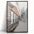 Large abstract wall art depicting a winter scene in muted blue and white tones, framed in black acrylic.