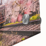 Close-up of large abstract wall art featuring vibrant transportation motifs on acrylic glass.