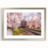 Textured abstract art print of swirling grays and silvers, framed in silver, ideal for bedroom decor.