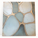 Abstract geometric canvas artwork featuring vibrant colors and dynamic shapes, elegantly leaning against a textured wall, enhancing modern interior decor.