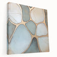 Abstract geometric stretched canvas artwork showcasing vibrant blue, orange, and yellow shapes, displayed in a side view to highlight its depth and texture, perfect for modern decor.