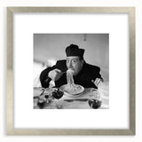 Textured abstract art print featuring indistinct figures in muted earth tones on a framed silver mat.