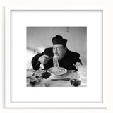 Abstract art print featuring figures in muted earth tones on a white framed canvas, suitable for dining room decor.