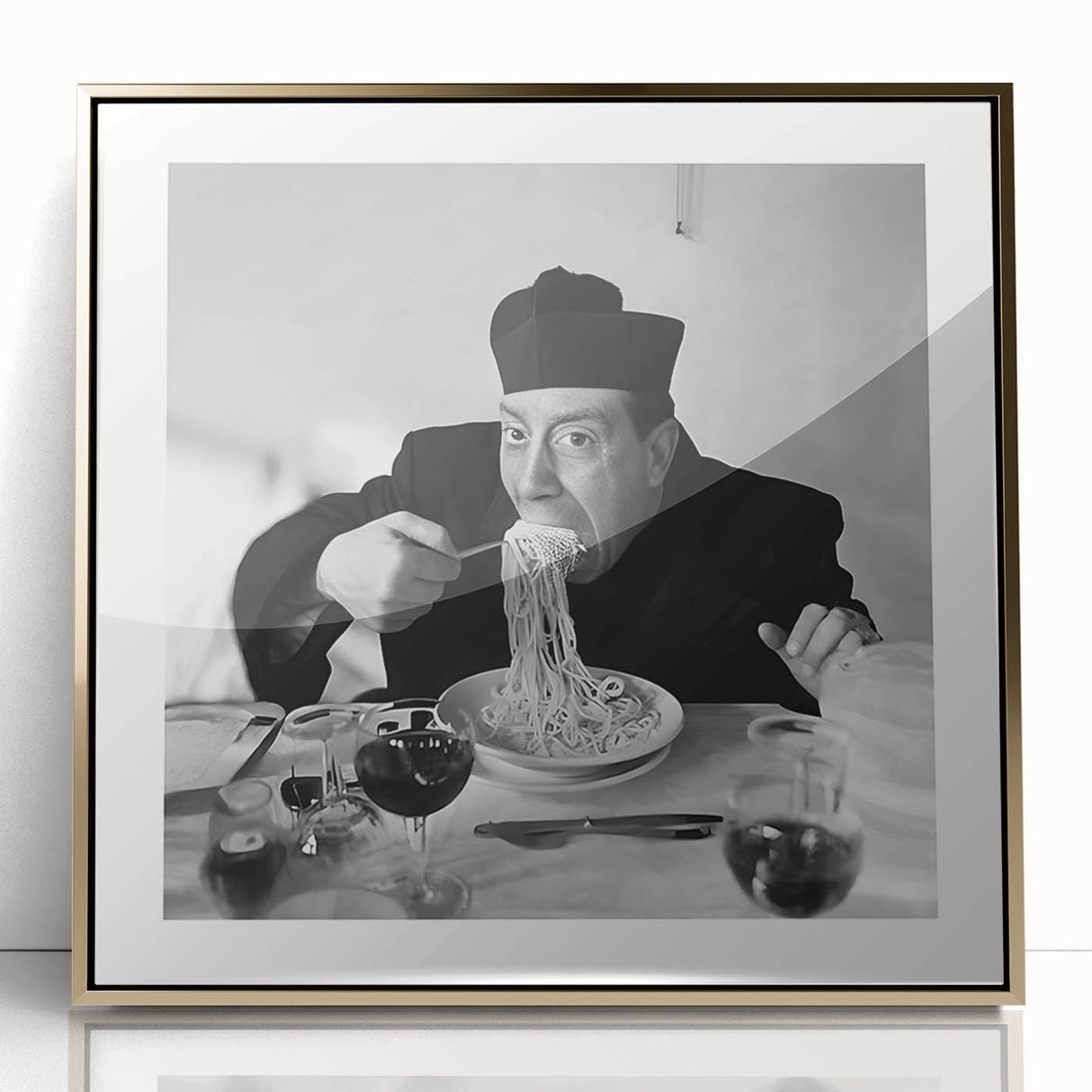 Mid-century modernist art featuring a stylized representation of people dining, in gold and black tones on acrylic.