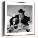 Framed canvas with a vintage poster-style landscape painting featuring colorful art on a black background.