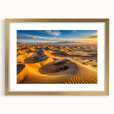 Textured abstract art print of Algerian scenery in muted earth tones, framed in gold, ideal for bedroom art.
