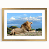 Textured art of abstract African scenery in warm earth tones, framed in gold, ideal for bedroom decor.