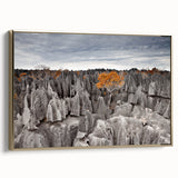 Framed canvas depicting a vibrant Madagascar landscape in gold, black, and colorful tones, ideal for living room decor.