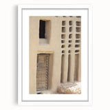 Extra large abstract art print depicting a textured African Mali scenery in muted earth tones, framed with a white mat.