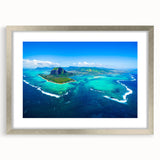 Abstract art print depicting a serene Mauritian landscape in cool blue and green tones, framed in silver.