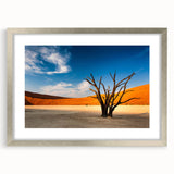 Abstract art print depicting a Namibian landscape in earth tones on a framed canvas.