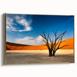 Landscape art painting of Namibia scenery on a framed canvas, featuring golden hues and black silhouette details.