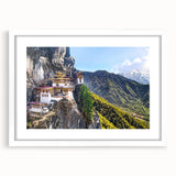 Abstract art print of Bhutan scenery in muted earth tones on a framed white mat, ideal for dining room decor.