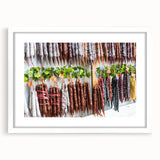 Abstract art print featuring muted earth tones and fluid shapes, framed with a white mat.