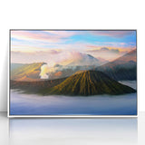 Acrylic print of a serene Indonesian landscape in muted green and blue tones, framed in white.