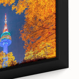 Close-up of a framed canvas featuring a textured depiction of Seoul's skyline in vibrant colors, ideal for living room decor.