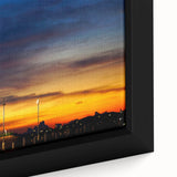 Close-up of a textured black wall art featuring a vibrant, colorful Malaysian landscape on a framed canvas.