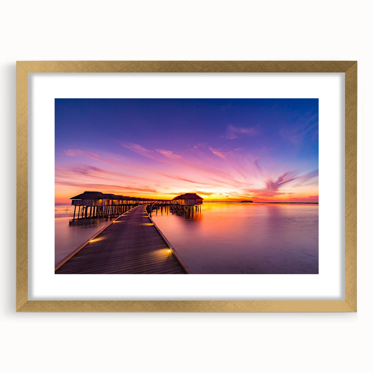 Extra large abstract art print of Maldivian scenery in gold frame, featuring textured blue and white tones.