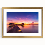 Extra large abstract art print of Maldivian scenery in gold frame, featuring textured blue and white tones.