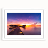 Abstract art print of a serene Maldivian beach in soft blue and white tones on a framed white mat.
