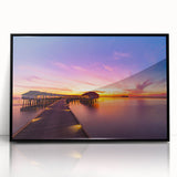 Large abstract wall art depicting a serene Maldivian seascape in muted blue and green tones, framed in black acrylic.