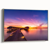 Framed canvas landscape art painting depicting a serene Maldivian beach scene in muted blue and sandy hues.