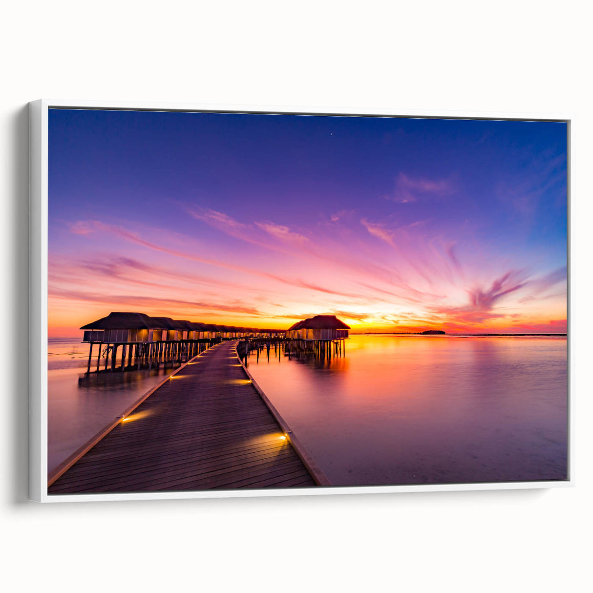 Vintage poster art of a Maldivian beach scene on a framed canvas with vivid blue and white tones.