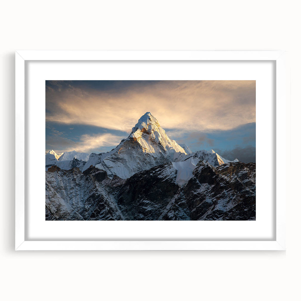 Abstract art print of Mount Everest in muted blue and gray tones on a framed white mat, suitable for dining room decor.