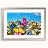 Textured art print of the Great Barrier Reef in abstract style, with vibrant blue and green hues on a framed silver mat.