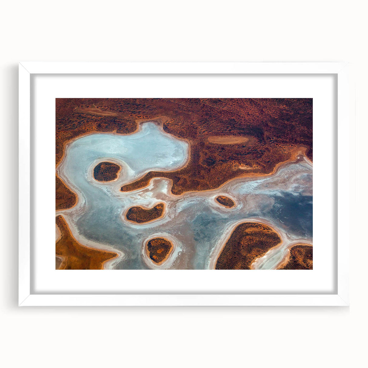 Extra large abstract art print featuring textured scenery of Queensland, Australia in muted earth tones, framed in white.