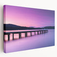 Side view of a stretched canvas depicting serene Tasmania scenery in cool blue and green tones.