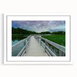 Abstract art print of New Brunswick scenery in muted earth tones on a framed white mat, ideal for dining room decor.