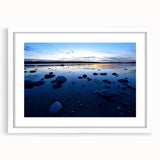 Abstract art print of the Northwest Territories in muted earth tones, framed with a white mat.