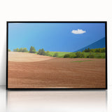 Large abstract wall art depicting a scenic Prince Edward landscape in muted green and blue tones, framed in black acrylic.