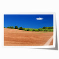 Rolled print of Prince Edward Island scenery with soft blue and green tones, ideal for dining room wall art.
