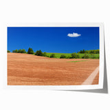 Rolled print of Prince Edward Island scenery with soft blue and green tones, ideal for dining room wall art.