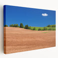 Scenic Prince Edward Island landscape on stretched canvas, featuring muted green and blue tones.