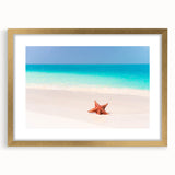 Abstract art print of a Caribbean scene in muted blue and green tones, framed in gold, ideal for dining room decor.