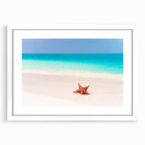 Textured abstract art print of a Caribbean scenery in muted blue and green tones on a framed white mat.