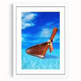 Abstract textured art print of a Caribbean landscape in soft blue and green tones, framed with a white mat.