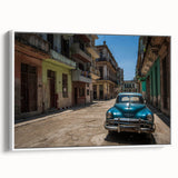 Framed canvas of a vintage Caribbean landscape painting, featuring vivid colors and black accents.