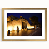 Abstract art print of a Caribbean scene in muted blue and green hues, framed in gold, ideal for dining room decor.