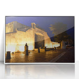 Large art print of a Caribbean beach scene on acrylic, framed in white.